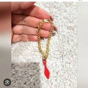 Christian Louboutin Red Bottom Shoe Charm On Gold Toned Chain. Multiple uses